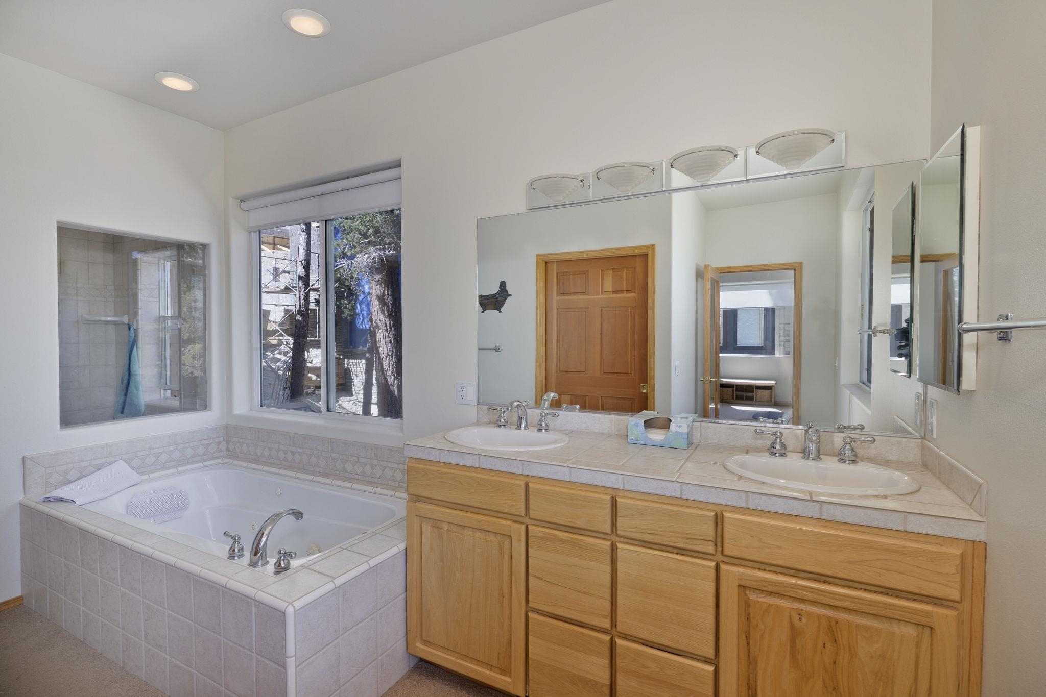 492 John Muir Road Mammoth Lakes, CA 93546 - Photo 17 of 33 Dual vanity with wood-finish cabinetry and undermount sinks
