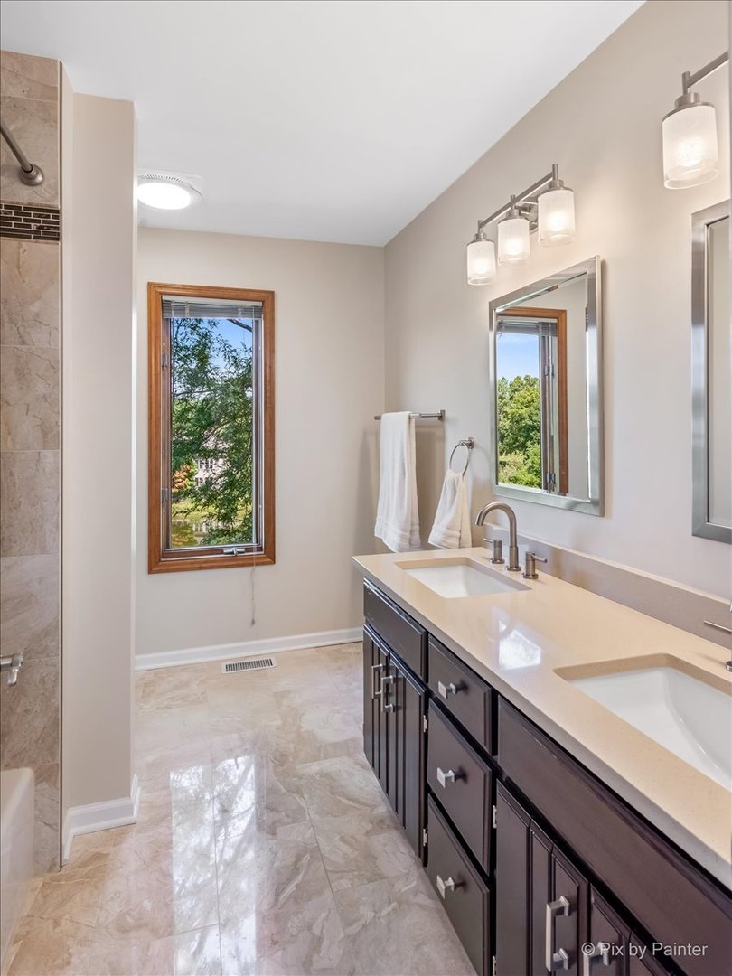 35W723 Parsons Road Algonquin, IL 60102 - Photo 29 of 52 a spacious bathroom with a granite countertop sink and a mirror