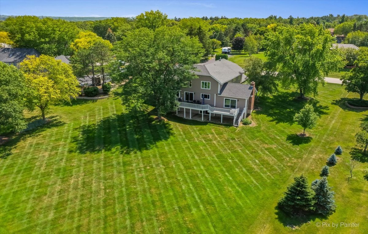 35W723 Parsons Road Algonquin, IL 60102 - Photo 47 of 52 a aerial view of a house with a big yard