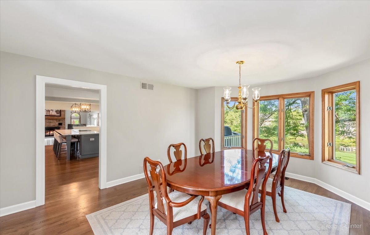 35W723 Parsons Road Algonquin, IL 60102 - Photo 8 of 52 a view of a dining room with furniture window and wooden floor