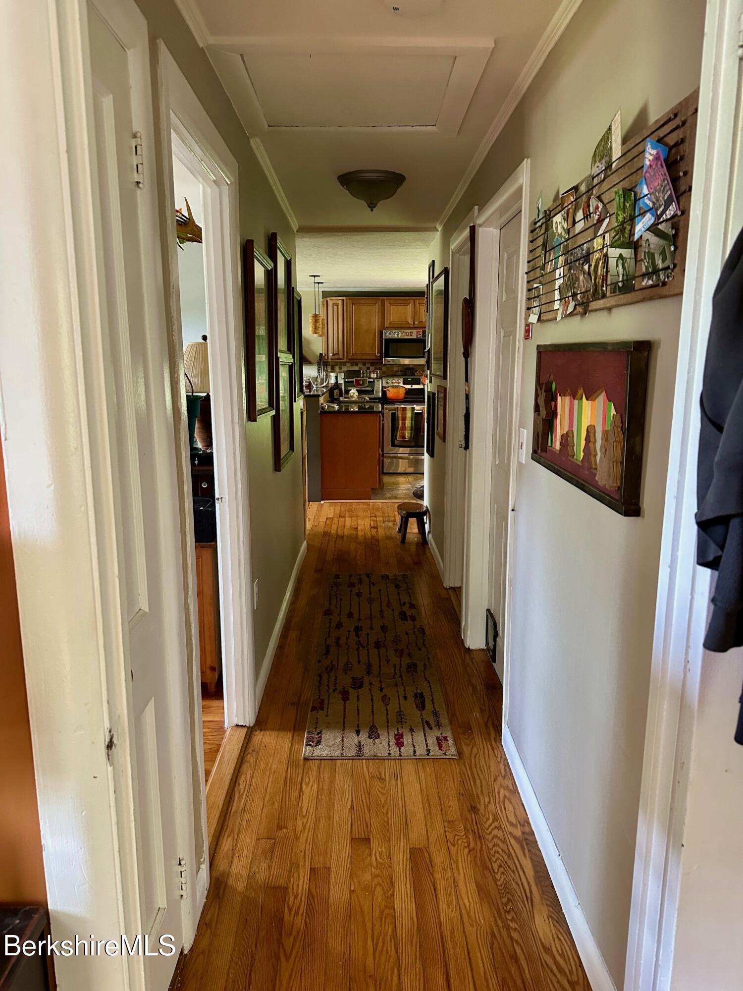 1872 North Main Road Otis, MA 01253 - Photo 12 of 33 a view of a hallway view with wooden floor and staircase