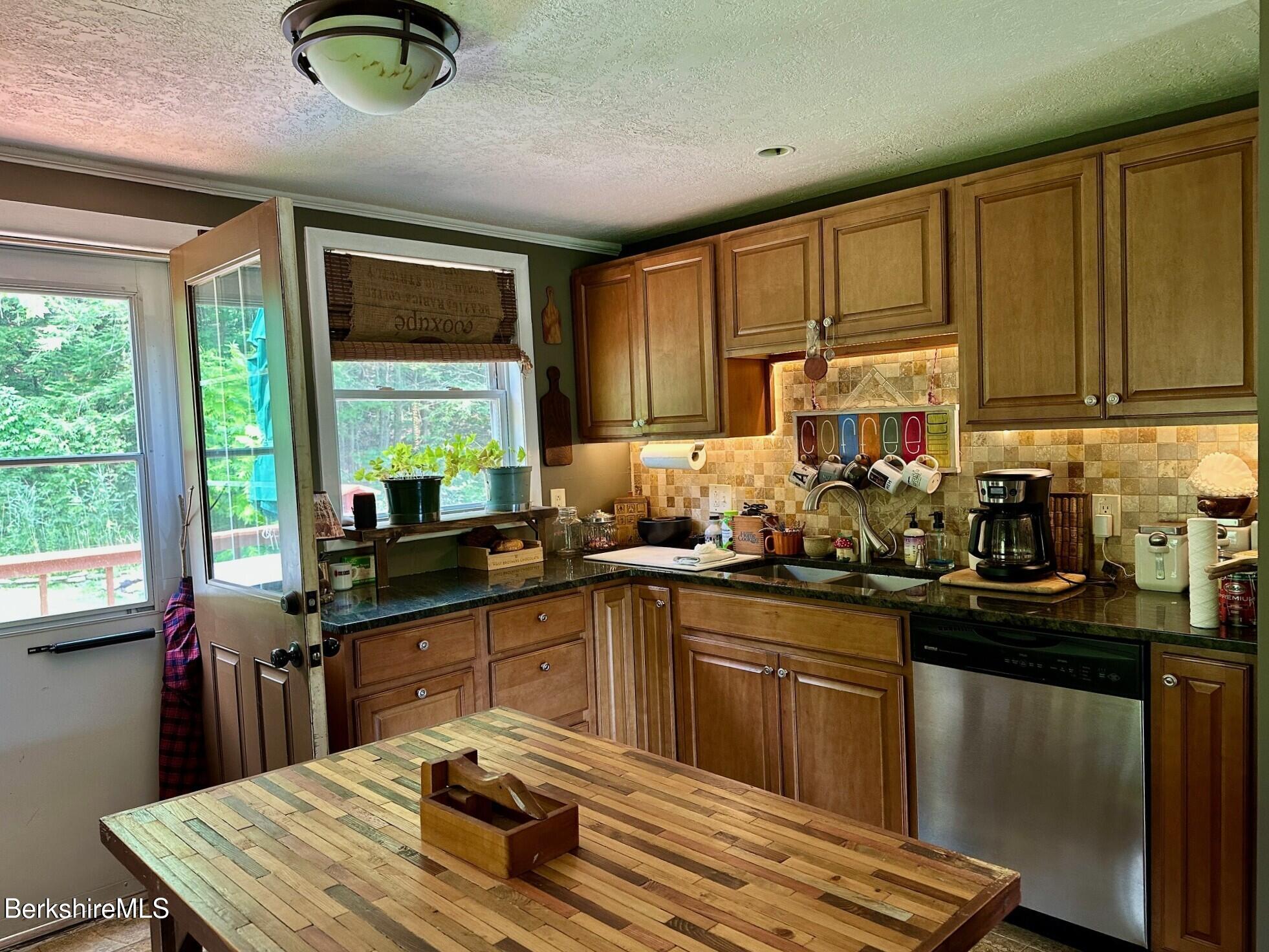 1872 North Main Road Otis, MA 01253 - Photo 2 of 33 a kitchen with a sink a window and appliances