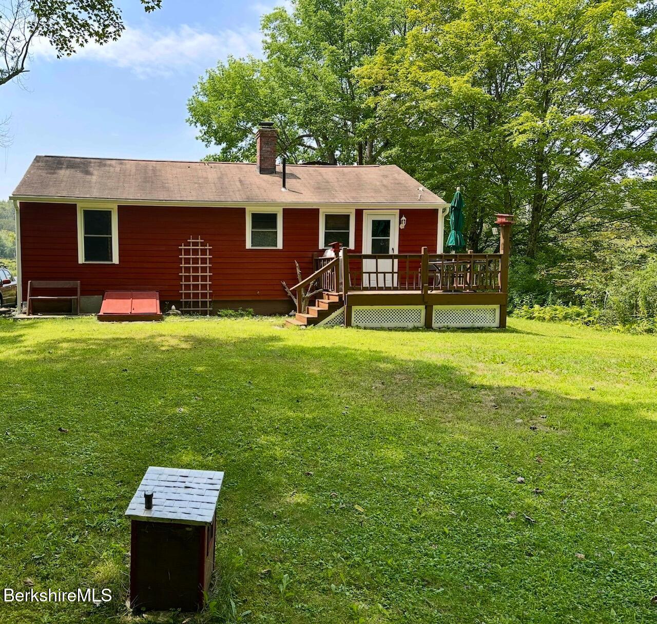 1872 North Main Road Otis, MA 01253 - Photo 25 of 33 a front view of a house with a garden