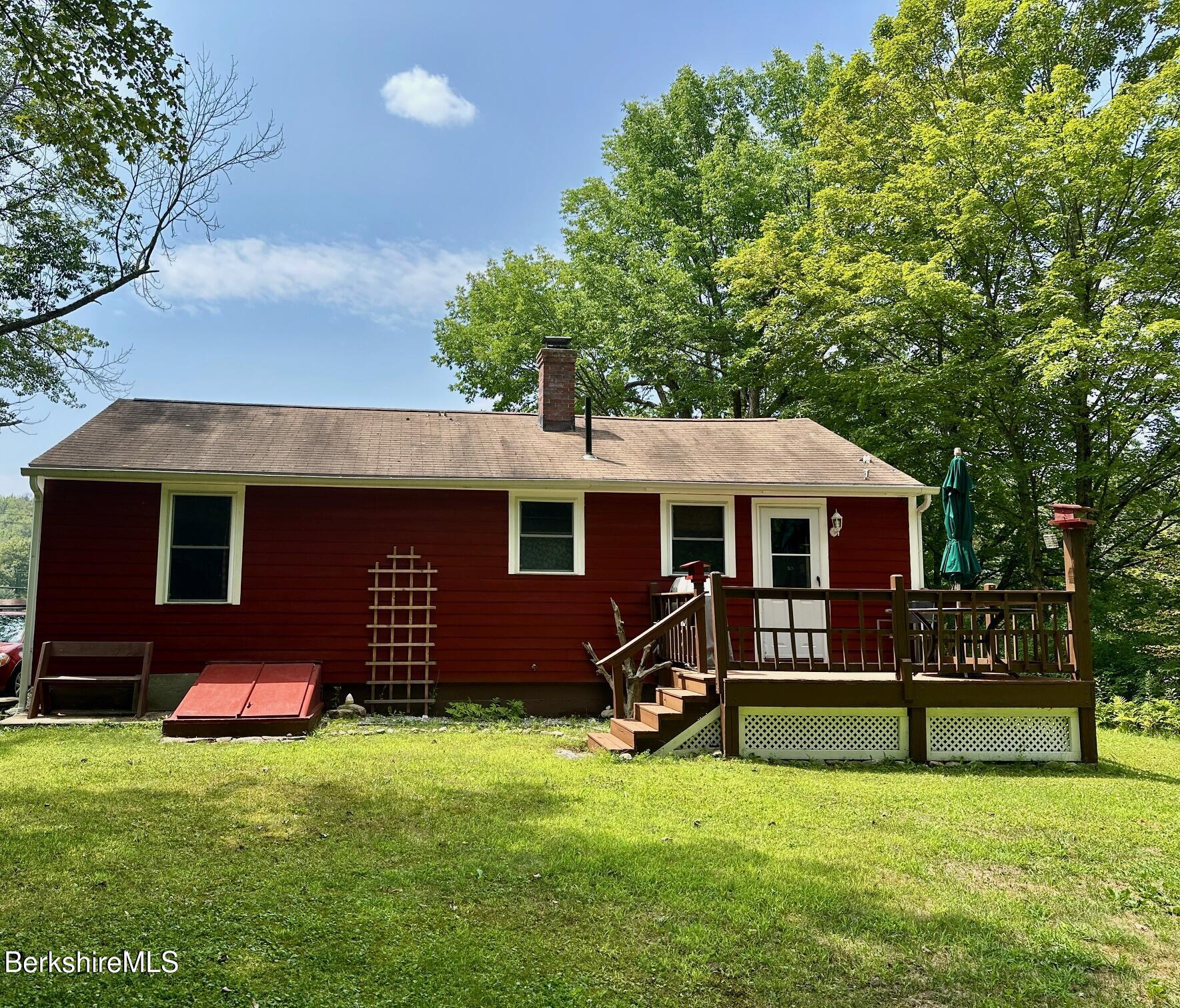 1872 North Main Road Otis, MA 01253 - Photo 27 of 33 a front view of a house with a yard
