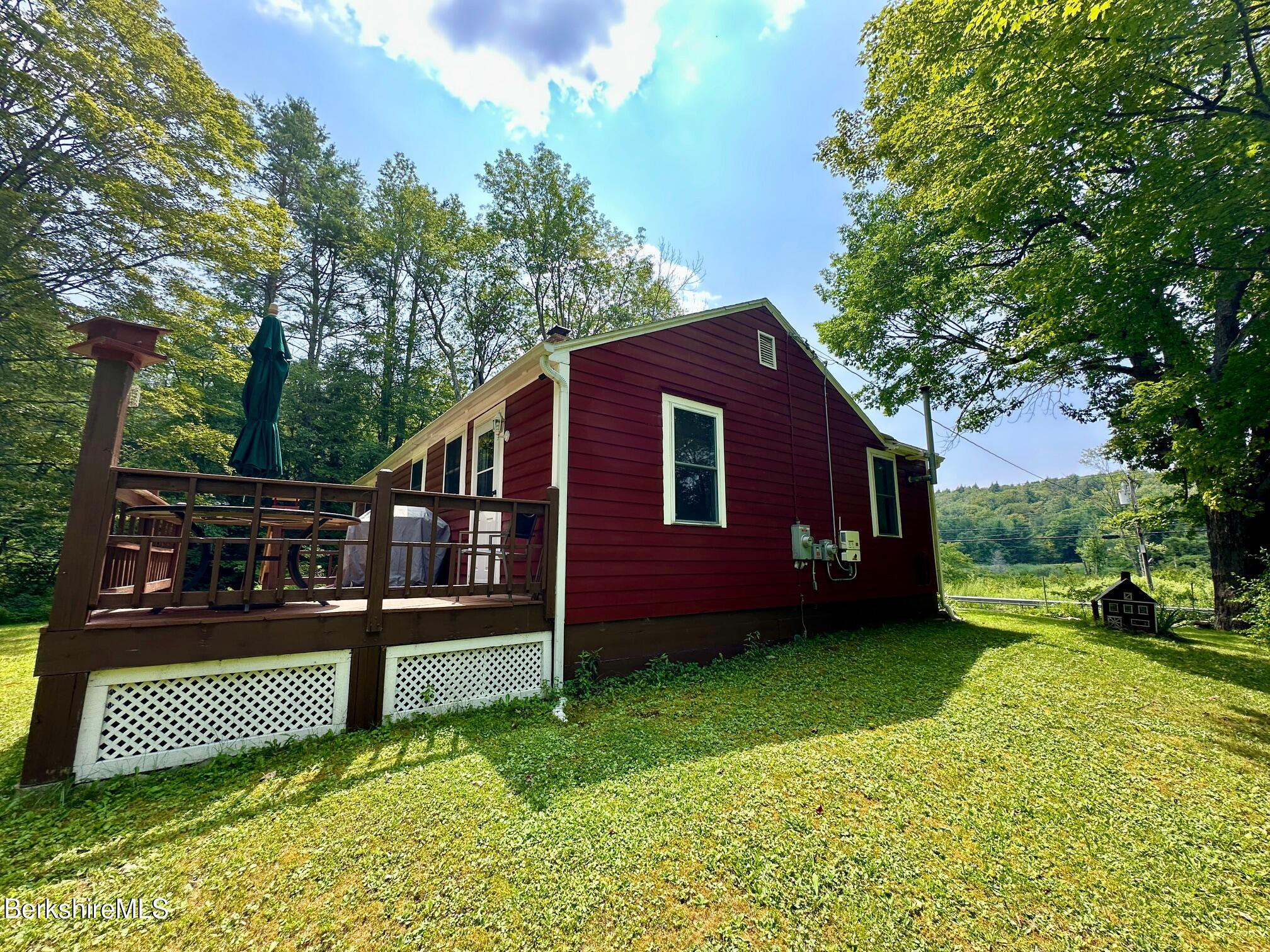 1872 North Main Road Otis, MA 01253 - Photo 28 of 33 a view of a yard with a house and a garden