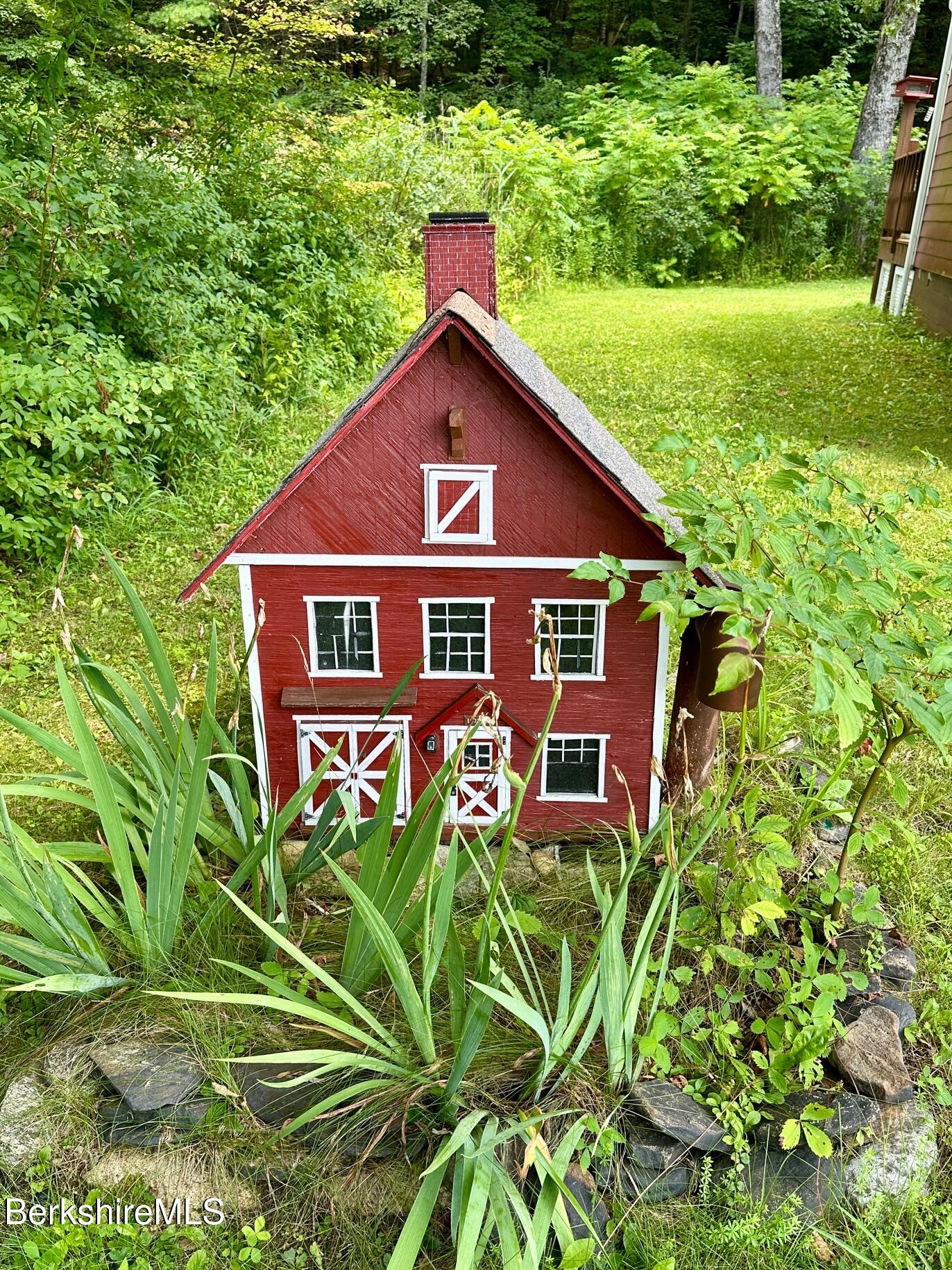 1872 North Main Road Otis, MA 01253 - Photo 8 of 33 a front view of a house with garden