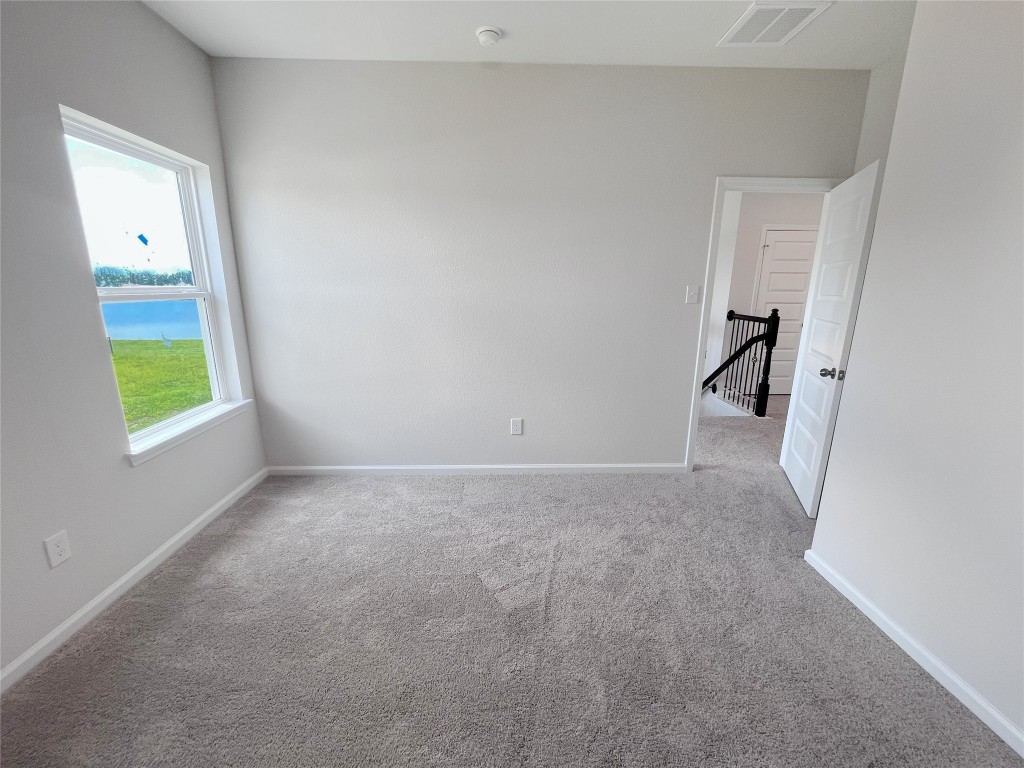 9710 Enclave Ridge Road Willis, TX 77318 - Photo 19 of 24 The Georgetown II- Bedroom 2. Sample image for illustration; upgrades, options, and colors may vary.