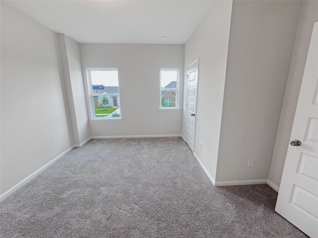 9710 Enclave Ridge Road Willis, TX 77318 - Photo 20 of 24 The Georgetown II- Bedroom 2. Sample image for illustration; upgrades, options, and colors may vary.