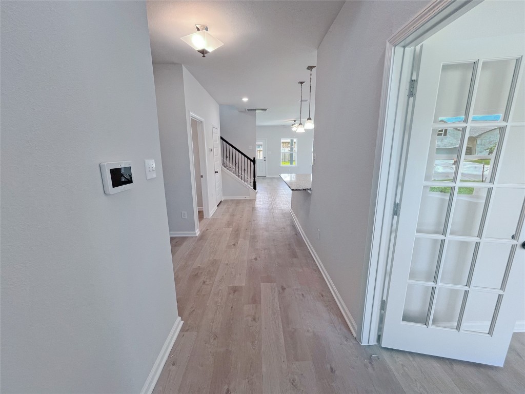 9710 Enclave Ridge Road Willis, TX 77318 - Photo 2 of 24 The Georgetown II- Foyer and Study. Sample image for illustration; upgrades, options, and colors may vary.