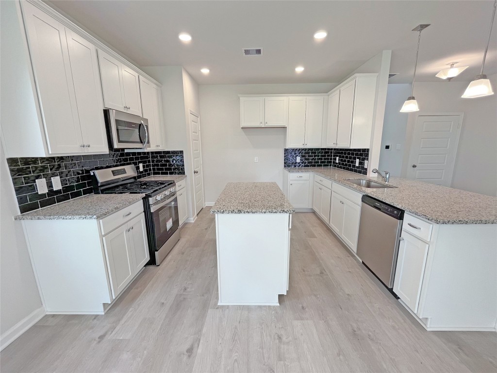 9710 Enclave Ridge Road Willis, TX 77318 - Photo 5 of 24 The Georgetown II- Kitchen. Sample image for illustration; upgrades, options, and colors may vary.