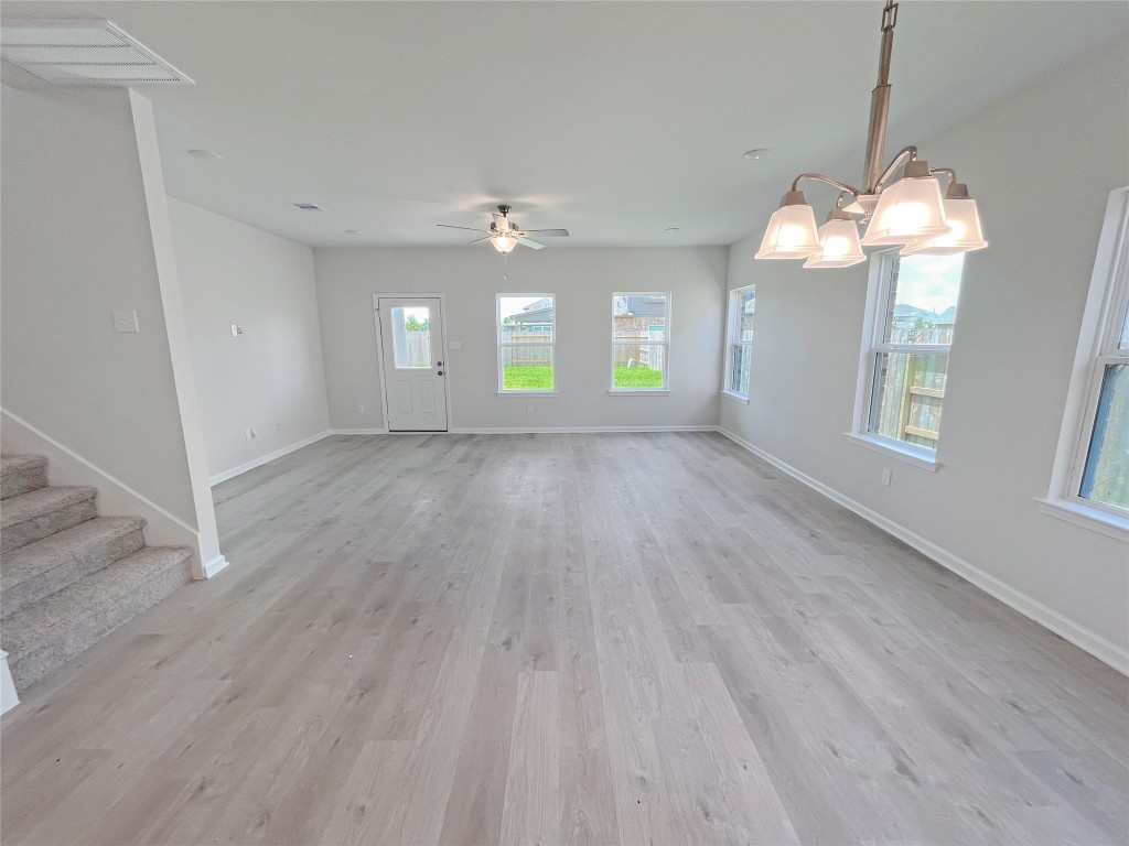 9710 Enclave Ridge Road Willis, TX 77318 - Photo 8 of 24 The Georgetown II- Dining into Family Room. Sample image for illustration; upgrades, options, and colors may vary.