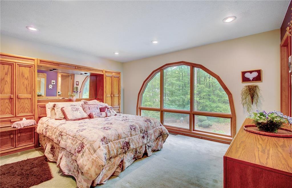 381 Branchton Road Slippery Rock, PA 16057 - Photo 11 of 25 Master Bedroom overlooks the swimming pool and the woods. Wake up here with your morning coffee in any season. 14x12 room has a master bath with soaking tub and shower.