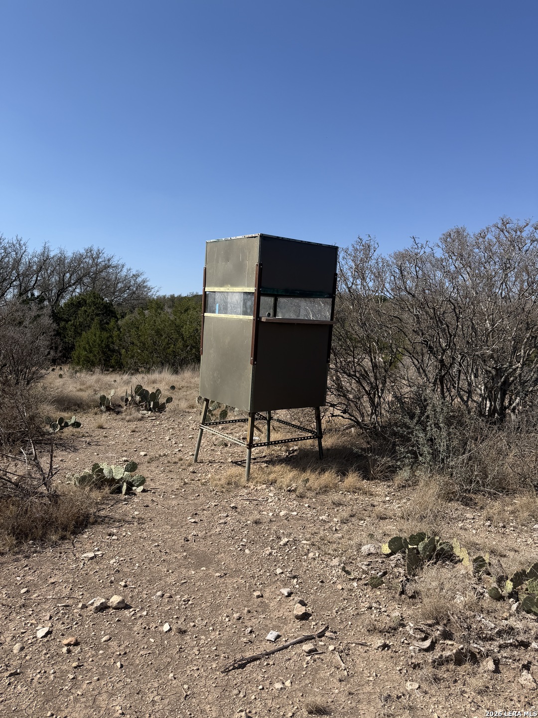2197 Sd 45340 Rocksprings, TX 78880 - Photo 36 of 37 a bench sitting in the middle of a field