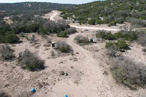 a view of a covered with trees in the background