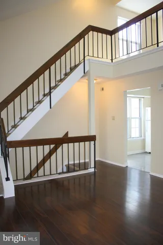 a view of an entryway door with wooden floor