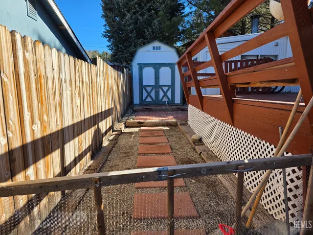 a view of a brick house with wooden stairs