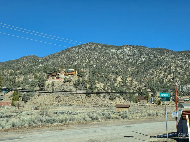 a view of street with parked cars