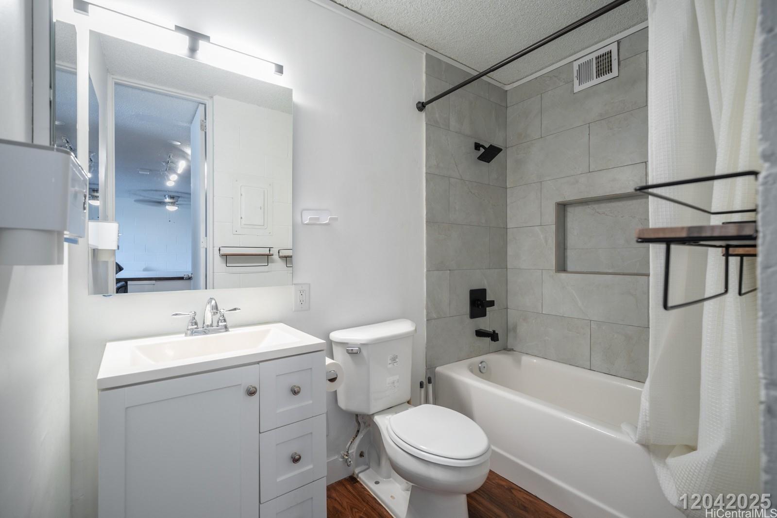 1415 Punahou Street, Unit 306 Honolulu, HI 96822 - Photo 13 of 19 a bathroom with a sink toilet and shower