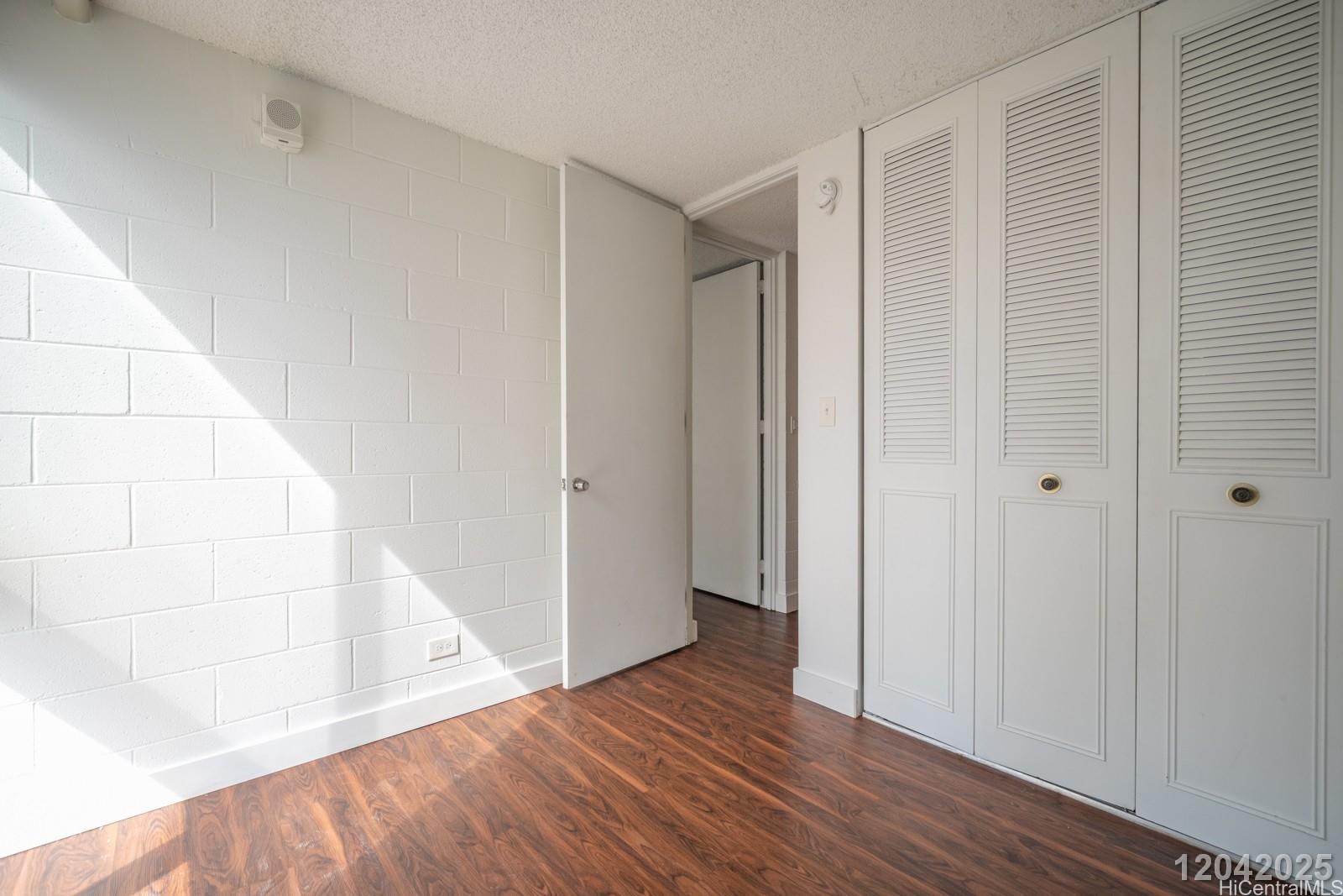 1415 Punahou Street, Unit 306 Honolulu, HI 96822 - Photo 15 of 19 a view of entryway with wooden floor