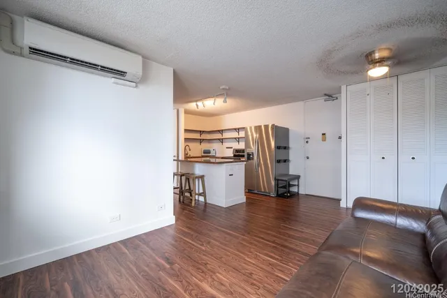 a view of kitchen with cabinets and wooden floor