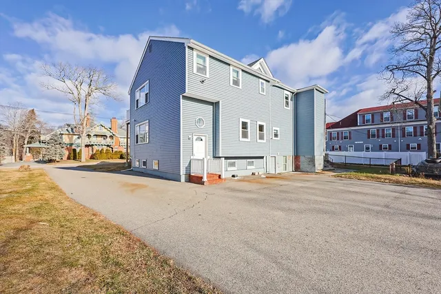 a front view of a building with a road