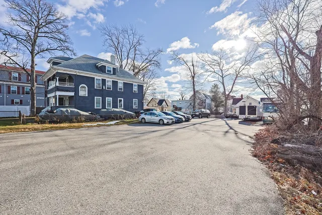 a view of a street with a building in the background
