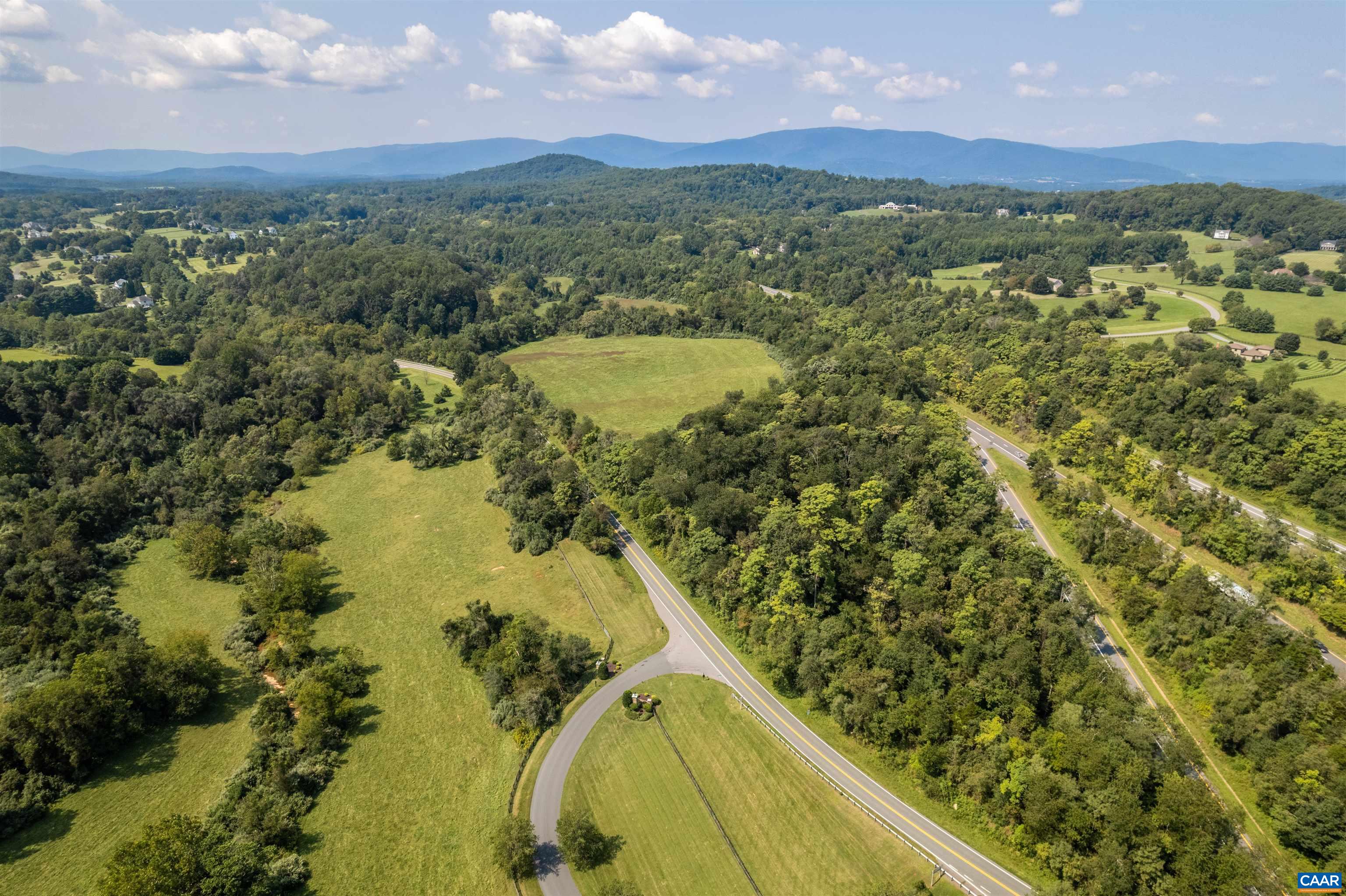 B1 Dick Woods Road Charlottesville, VA 22903 - Photo 4 of 11 a view of a lake with a mountain