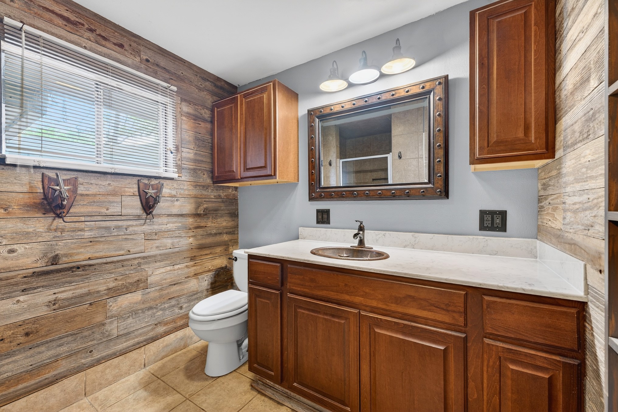 304 Fullen Street Conroe, TX 77301 - Photo 15 of 25 The primary bath has been updated with rustic charm and extra storage!