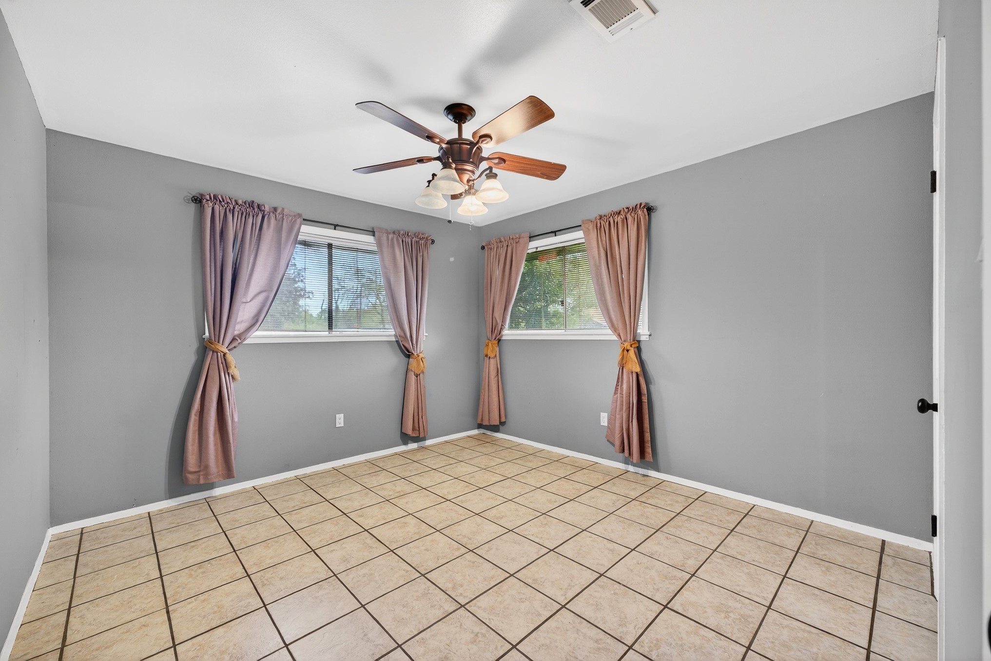 304 Fullen Street Conroe, TX 77301 - Photo 22 of 25 Bedroom 3 has tile flooring.
