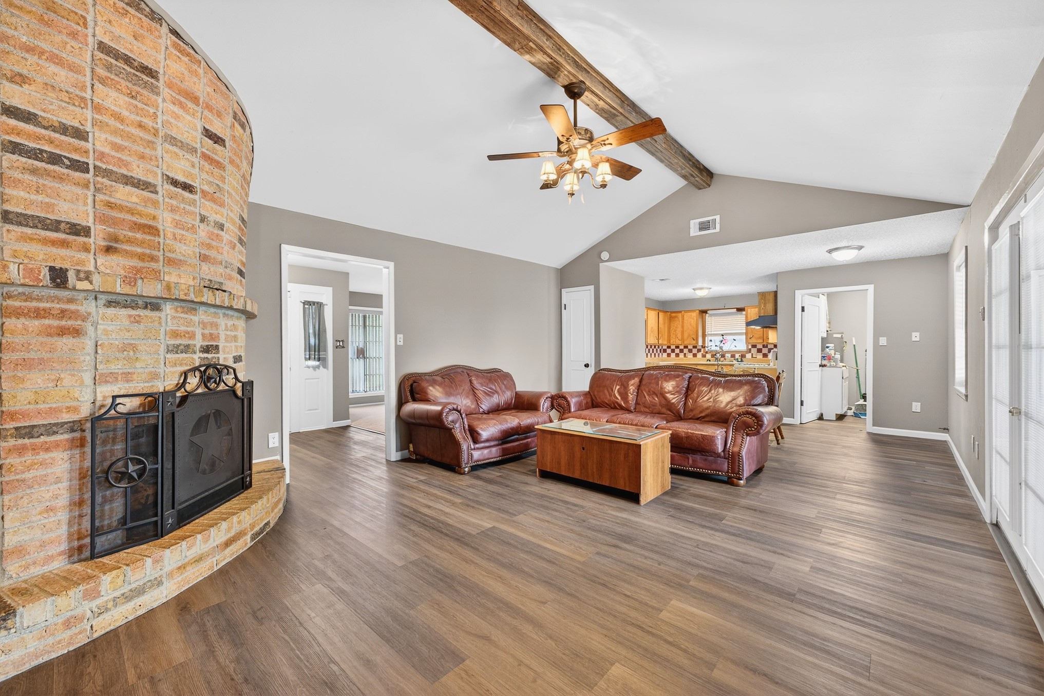 304 Fullen Street Conroe, TX 77301 - Photo 4 of 25 An open concept feels united by the flooring that flows throughout.