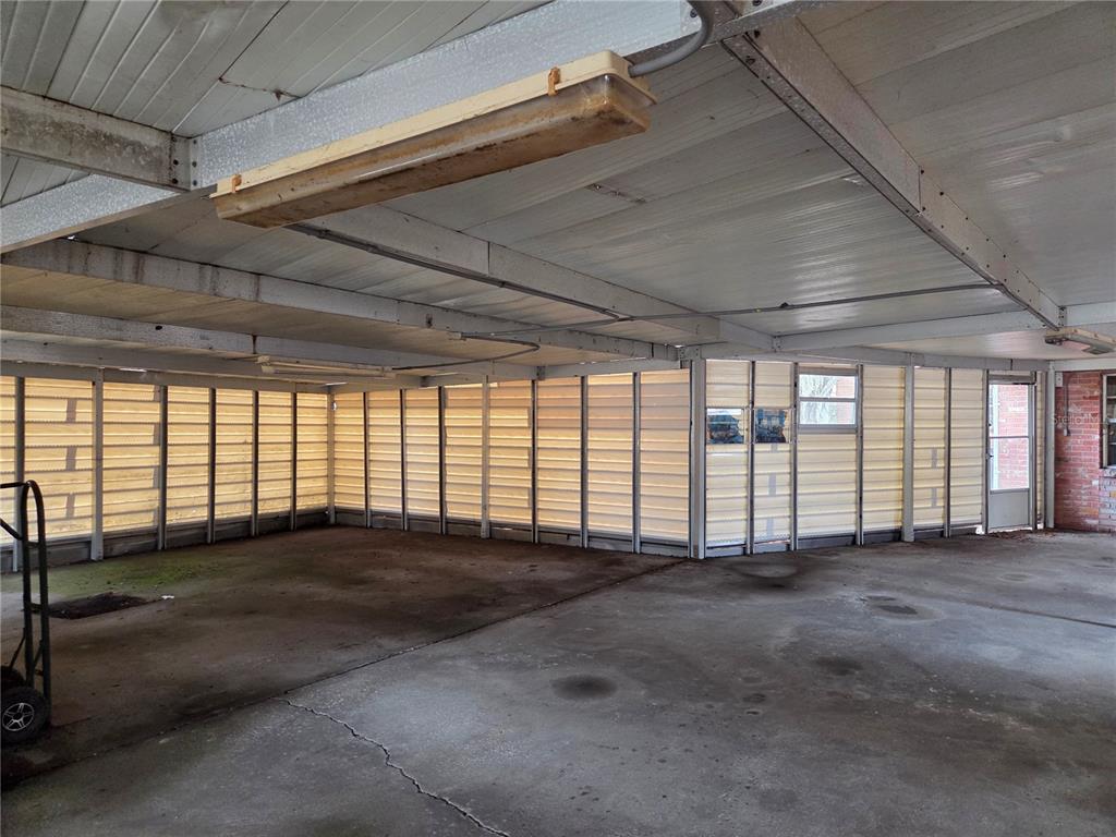 4911 West Sam Allen Road Plant City, FL 33565 - Photo 7 of 11 a view of an empty room with a window