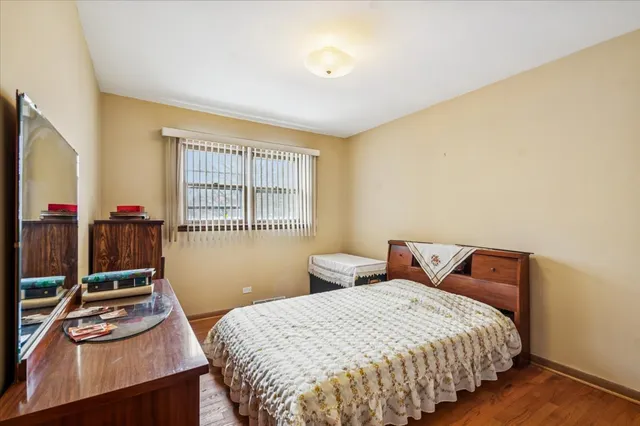 a bedroom with bed and window