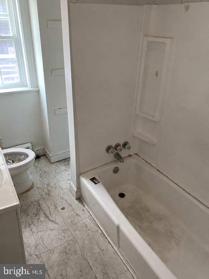 45 Golf Road Upper Darby, PA 19082 - Photo 12 of 13 a bath tub sitting next to a sink