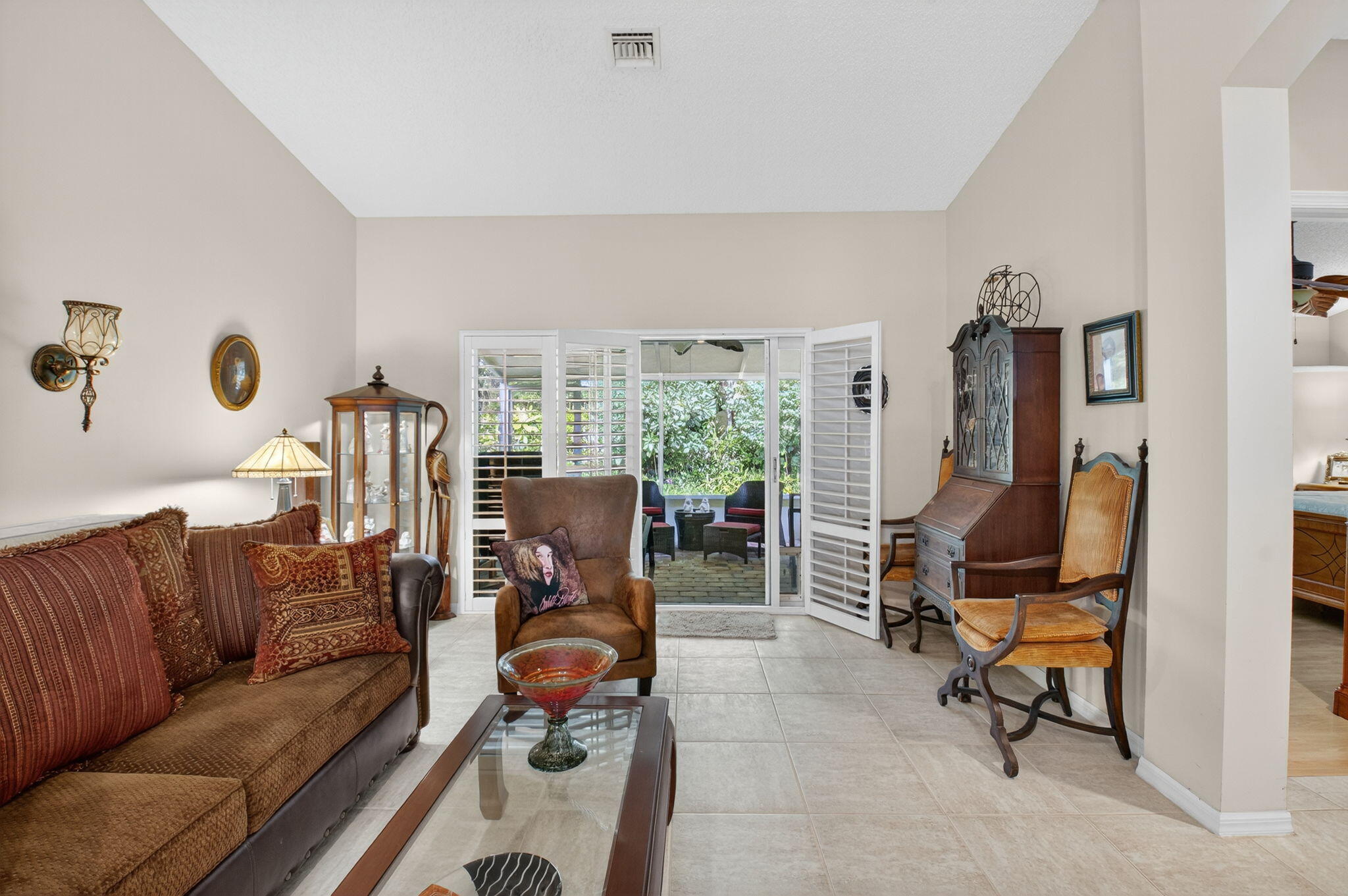6129 Petunia Road Delray Beach, FL 33484 - Photo 17 of 73 a living room with furniture gym equipment and a large window