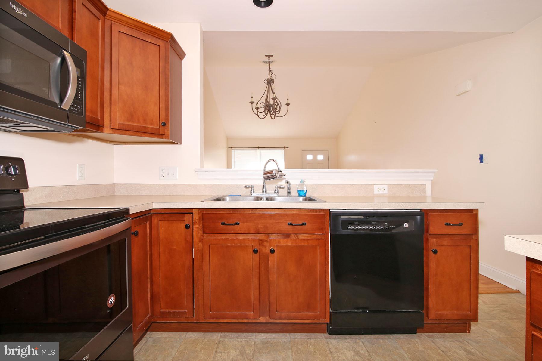 43 Farm Lane Lancaster, PA 17603 - Photo 20 of 42 a kitchen with stainless steel appliances granite countertop a sink and cabinets