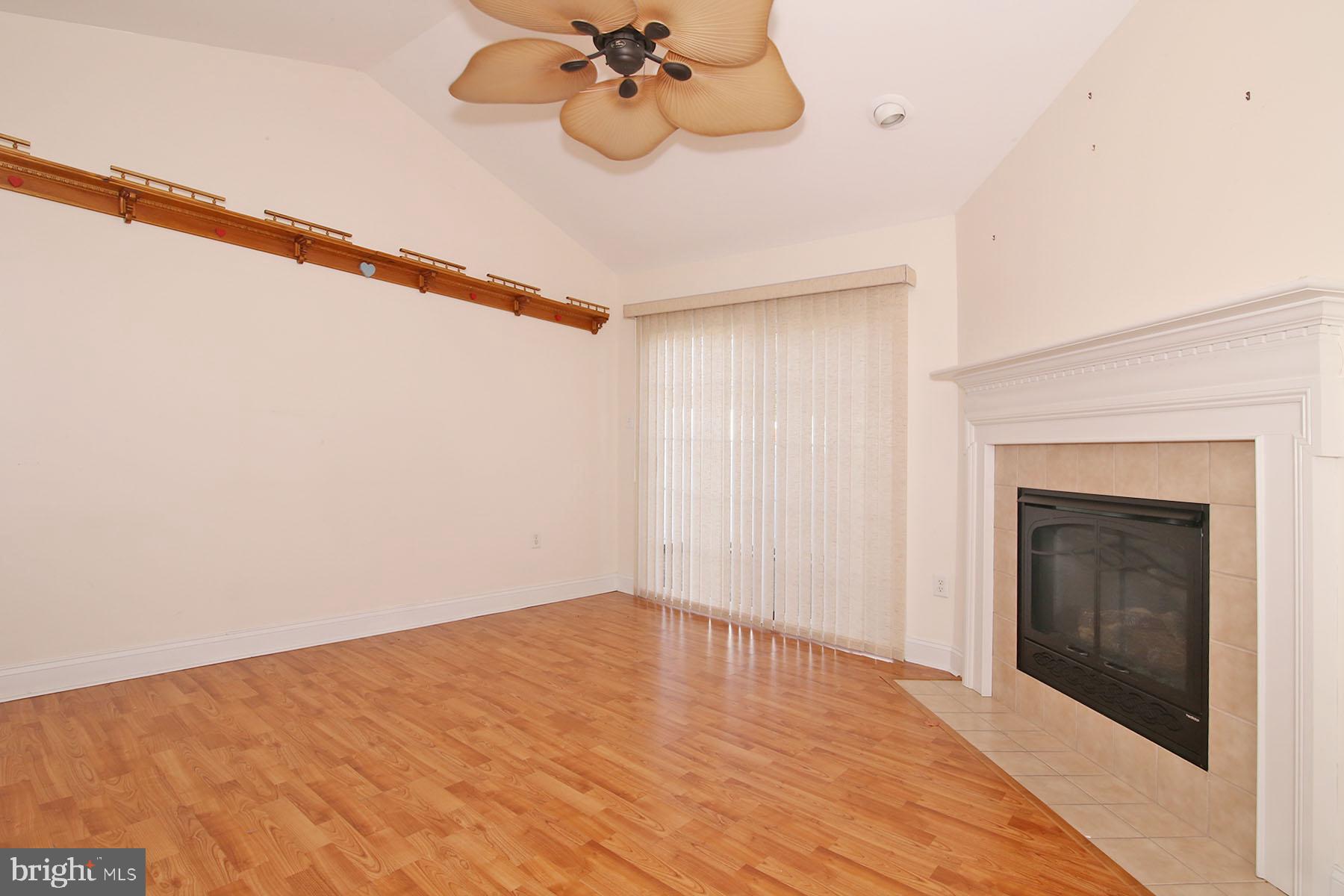 43 Farm Lane Lancaster, PA 17603 - Photo 25 of 42 a view of a room with a ceiling fan and a fireplace