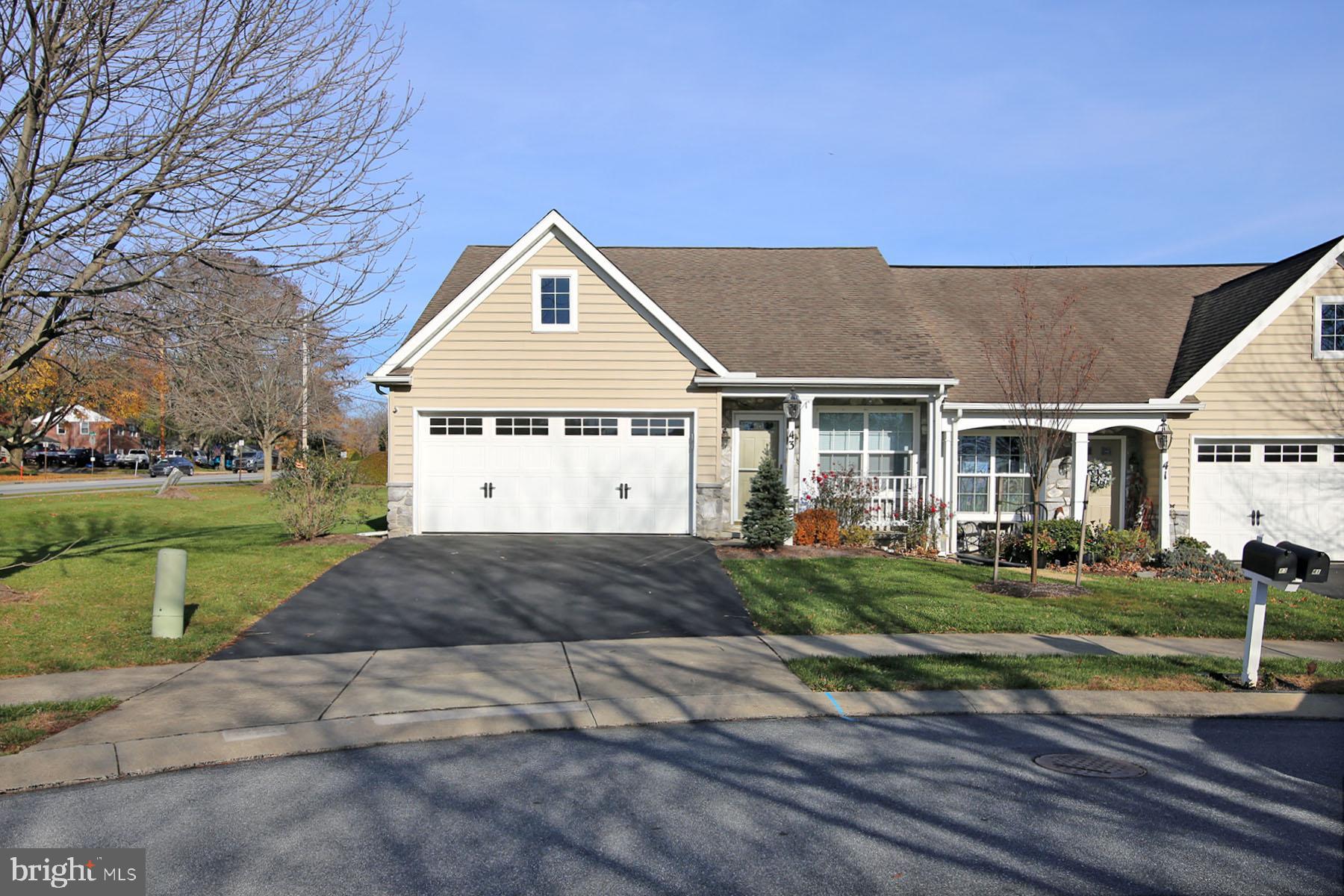 43 Farm Lane Lancaster, PA 17603 - Photo 5 of 42 a front view of a house with a yard and garage