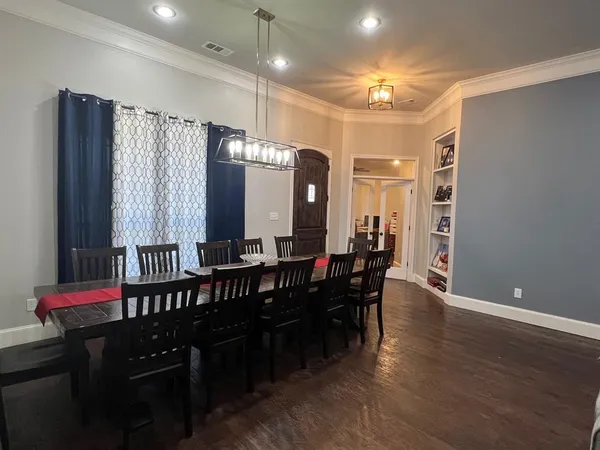a kitchen with a refrigerator a sink dishwasher stove and oven
