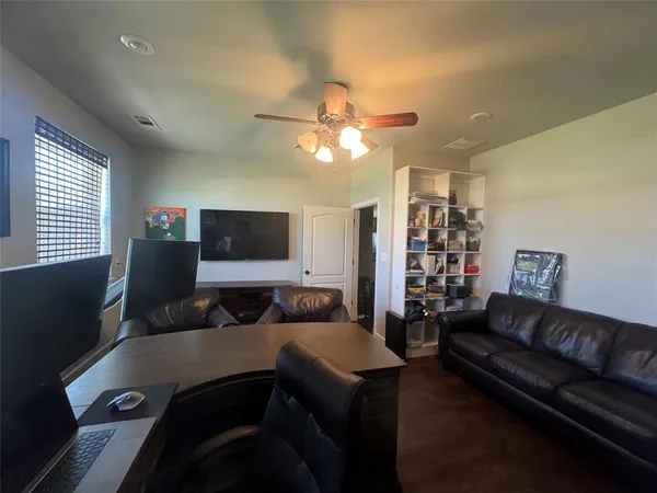 a bathroom with a tub a window and a shower