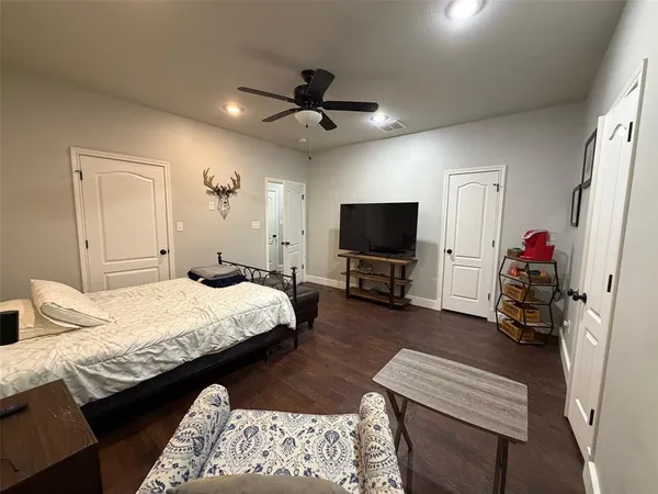a bathroom with a sink mirror and a toilet
