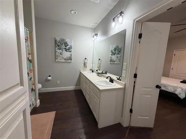 a bedroom with bed couch and window