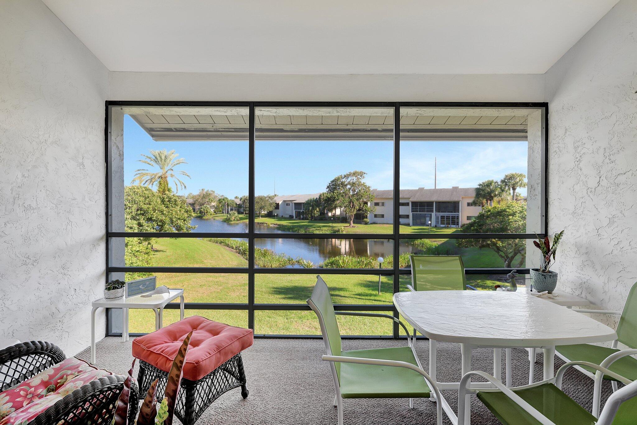 3001 Southeast Aster Lane, Unit 906 Stuart, FL 34994 - Photo 2 of 24 a view of a dining room with furniture window and outside view
