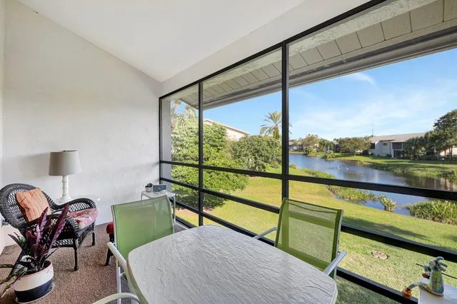 a view of a room with furniture and window