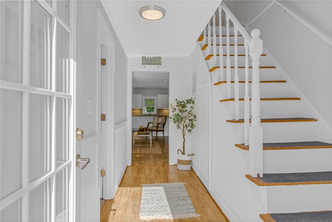 97 Virginia Road Irvington, VA 22480 - Photo 6 of 39 Foyer with light wood-style flooring and stairway