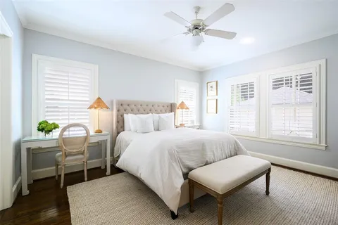 a bedroom with furniture and a window