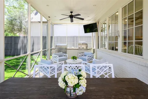 a view of a dining room with furniture a chandelier and wooden floor