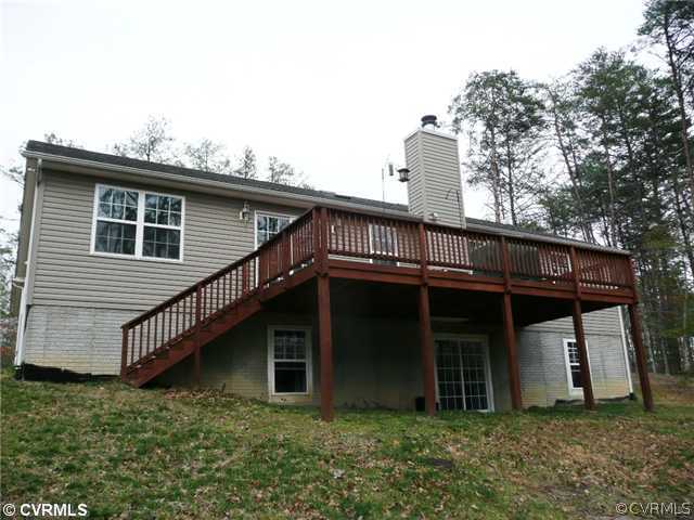 14309 Dry Bridge Road Ruther Glen, VA 22546 - Photo 3 of 4 a front view of a house with garage