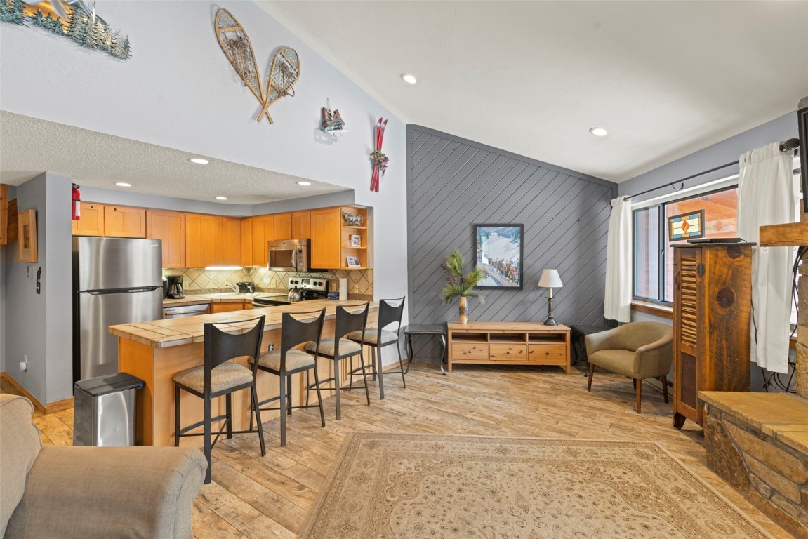 405 4 O Clock Road, Unit 12F Breckenridge, CO 80424 - Photo 10 of 43 View of kitchen with a breakfast bar