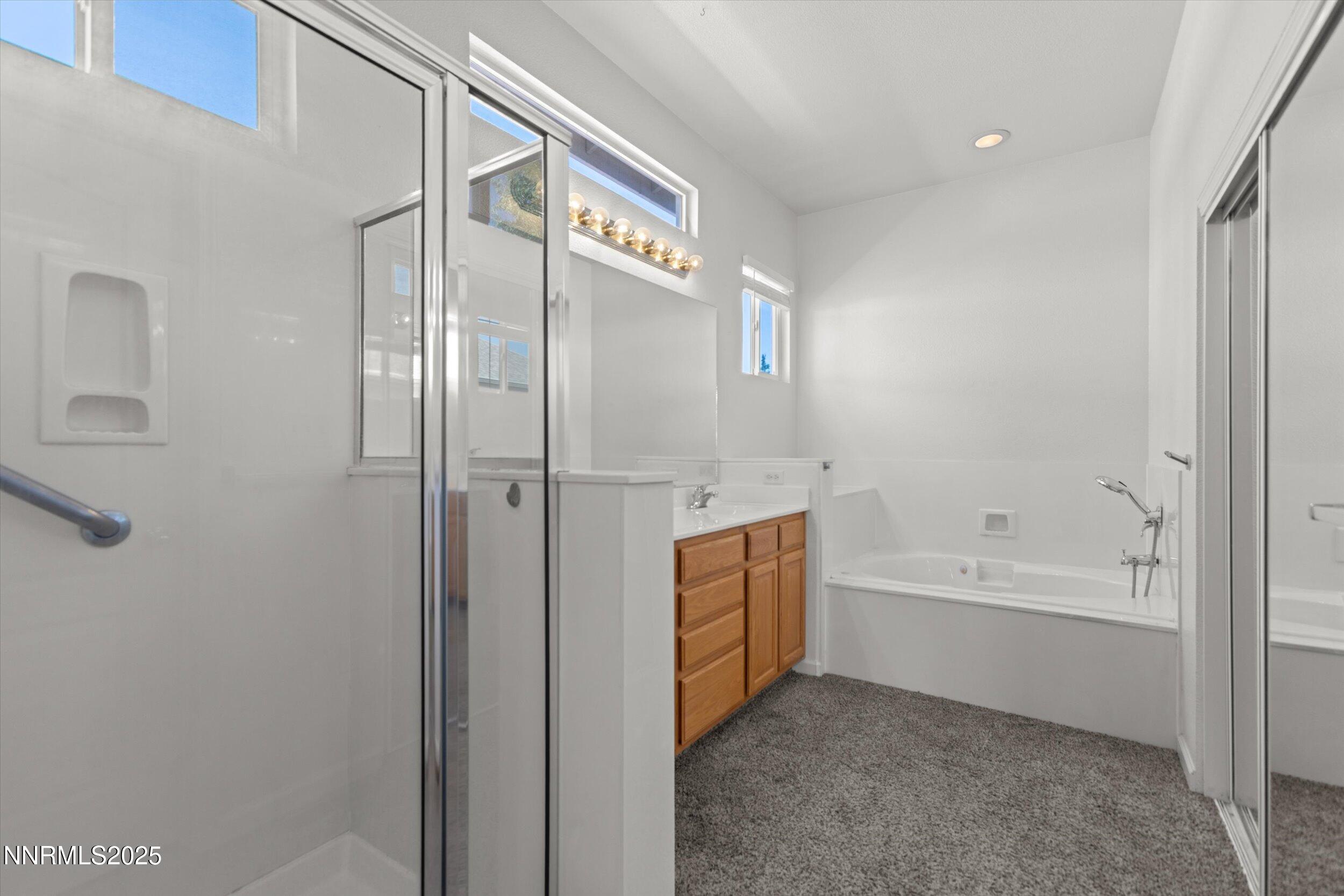 2365 Red Maple Court Reno, NV 89523 - Photo 29 of 34 a bathroom with a bathtub and a shower