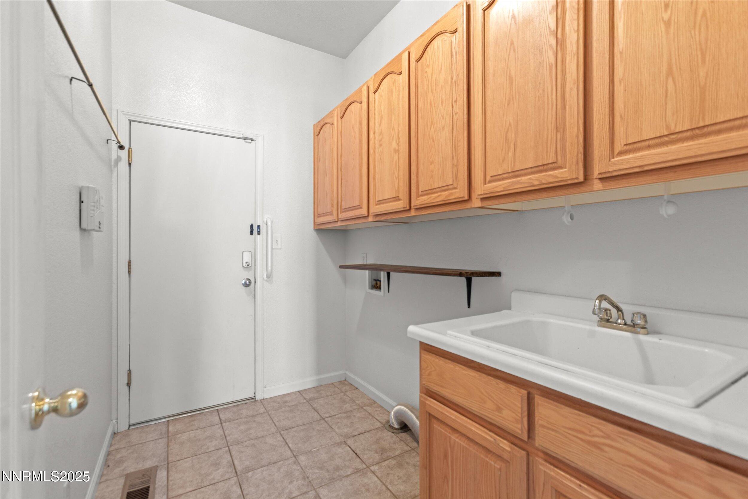 2365 Red Maple Court Reno, NV 89523 - Photo 31 of 34 a bathroom with a sink and a white cabinet